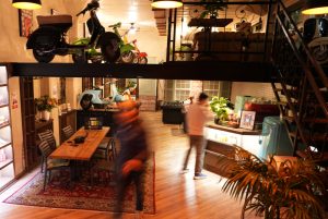 The inside of Seknd Nature's Bree Street sports classic Vespas perched on beams overhead, creating an inspiring environment for cannabis lovers to relax and socialise in.